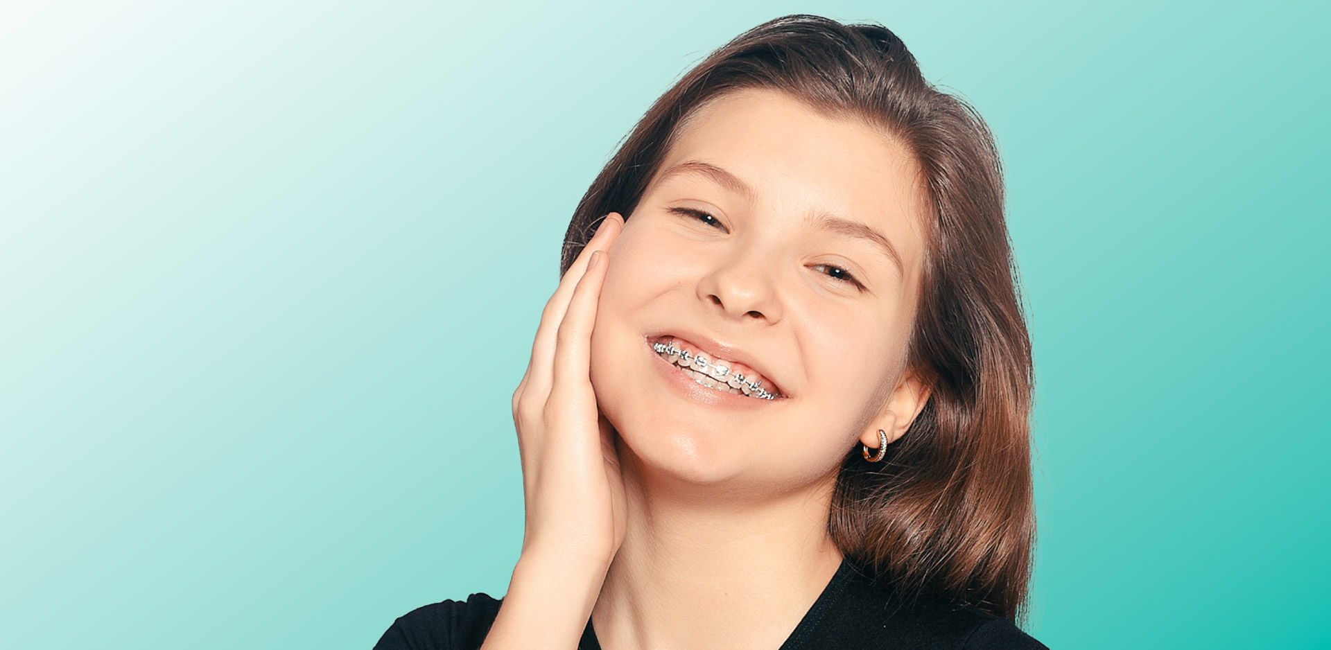kid with braces smiling